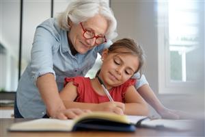 Grandmother helping with homework